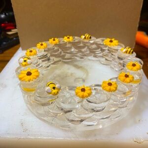 Recycled, poly carbon plastic with decorative flowers and bumblebees